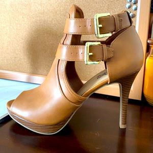 Brash brown leather, buckle heels. Size 10. Only worn a couple times